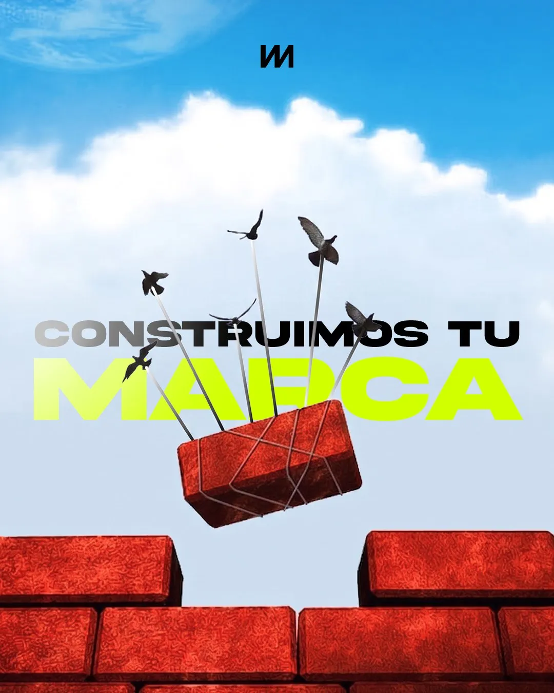 Construimos tu marca: un ladrillo rojo vuela sobre un muro en construcción, sostenido por pájaros